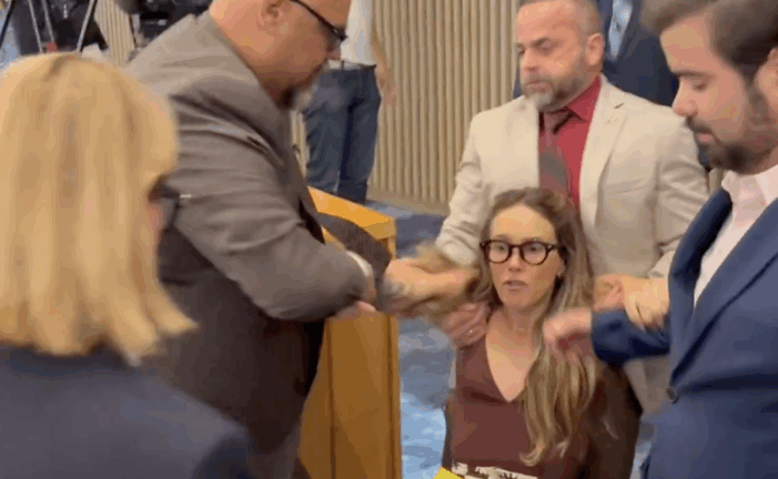 Miami-Dade commissioners sit silent as resident is dragged out of County Hall